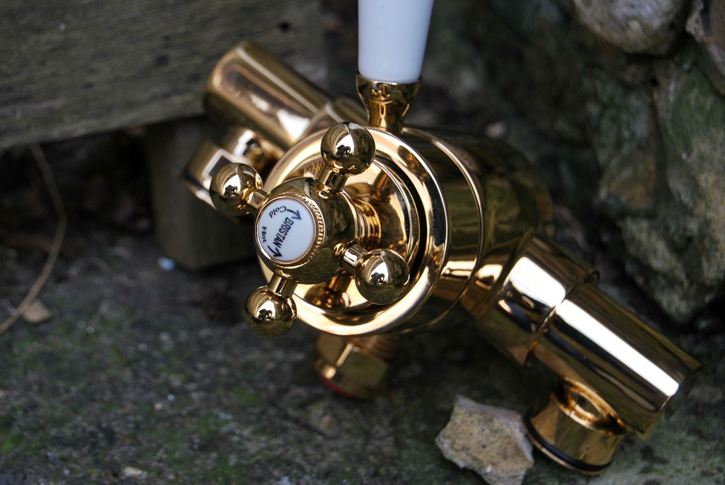 Shower mixer tap refinished to a gold tone finish
